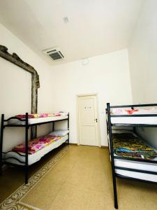 Postel nebo postele na pokoji v ubytování Salerno Experience Hostel