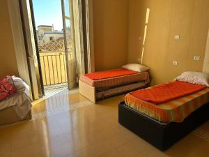 Postel nebo postele na pokoji v ubytování Salerno Experience Hostel