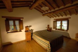 Una cama o camas en una habitación de Ca' Matra