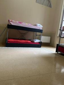 Postel nebo postele na pokoji v ubytování Salerno Experience Hostel