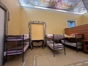 Postel nebo postele na pokoji v ubytování Salerno Experience Hostel