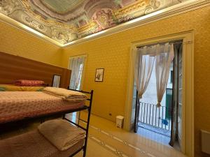 Postel nebo postele na pokoji v ubytování Salerno Experience Hostel