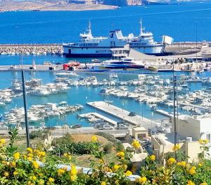 a harbor with boats docked in the water at Grand Hotel Gozo in Għajnsielem