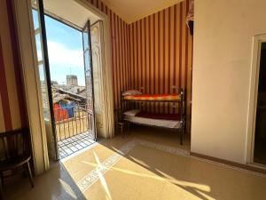Postel nebo postele na pokoji v ubytování Salerno Experience Hostel