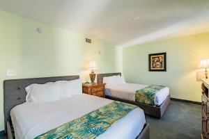 Postelja oz. postelje v sobi nastanitve Paradise Resort, Unit 802, 4 Bedroom, 3 Bath, Direct Oceanfront