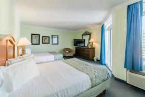 Postelja oz. postelje v sobi nastanitve Paradise Resort, Unit 802, 4 Bedroom, 3 Bath, Direct Oceanfront