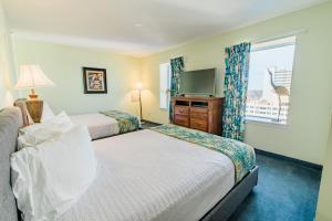 Postelja oz. postelje v sobi nastanitve Paradise Resort, Unit 802, 4 Bedroom, 3 Bath, Direct Oceanfront