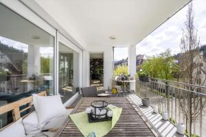a balcony with a table and chairs on a deck at Luxuszimmer für hohe Ansprüche in Baden-Baden