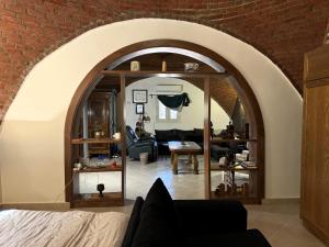 an archway in a living room with a brick wall at 1-Bedroom Guesthouse in Giza