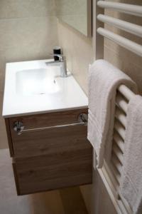 a bathroom with a sink and a mirror at Angolo di Paradiso in Mirano