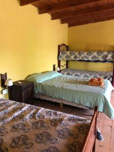 Ένα ή περισσότερα κρεβάτια σε δωμάτιο στο Departamentos Peumayen Cabaña