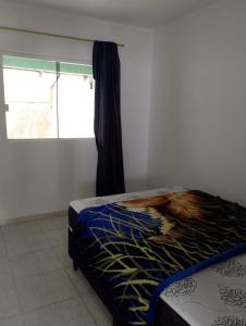 Ένα ή περισσότερα κρεβάτια σε δωμάτιο στο Casa F Pontal do Paraná +10 φωτογραφίες