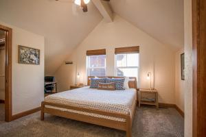 a bedroom with a bed with blue pillows and a window at Dover Bay Way in Dover