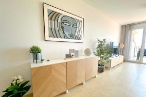 a room with a desk with a painting on the wall at Vista Bonita - Mar Menor Golf Resort in Torre-Pacheco