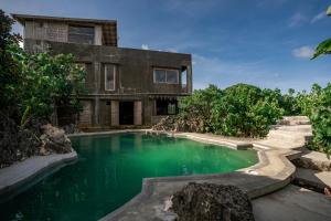 a house with a swimming pool in front of it at Izustarri in Burgos