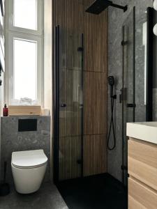 Kúpeľňa v ubytovaní City center apartment-Wrocławska + 7 fotografií