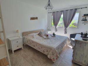 Postel nebo postele na pokoji v ubytování Le Paradis