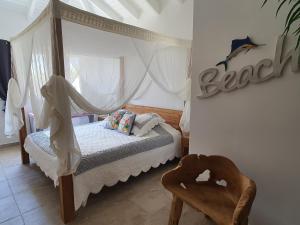 Postel nebo postele na pokoji v ubytování Le Paradis
