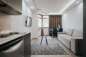 A seating area at Poem Apartments, Las Canteras