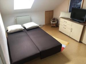 Postel nebo postele na pokoji v ubytování Ferienwohnung Buchbergblick