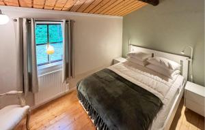 Llit o llits en una habitació de Amazing Home In Knäred