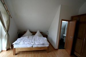 Ένα ή περισσότερα κρεβάτια σε δωμάτιο στο Haus 145 2, Kiefernweg 10 a