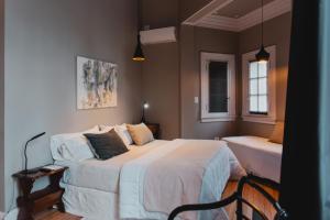 a bedroom with a large bed and a window at Elena Hotel Boutique in Azul