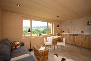 a kitchen and living room with a table and a window at Ferienloft Waldblick in Schwarzenberg +61 photos