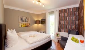 Ένα ή περισσότερα κρεβάτια σε δωμάτιο στο FeWo 43 1, Heideweg 3 a