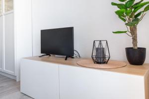 Televízia a/alebo spoločenská miestnosť v ubytovaní Estudio Mojito + 9 fotografií