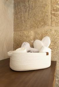 a basket of items sitting on top of a table at O Fogar da Pequena Galia in Caldas de Reis