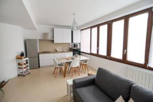 a living room with a couch and a table at Ca' Clausus in Clusone