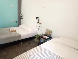 A bed or beds in a room at Imagine hostel