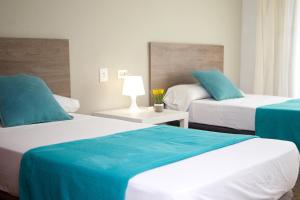 Postel nebo postele na pokoji v ubytování Hostal Garamar