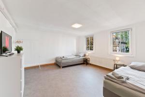 Ένα ή περισσότερα κρεβάτια σε δωμάτιο στο XXL-Apartments Göppingen