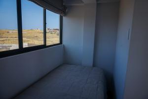 Postel nebo postele na pokoji v ubytování Che Lobitos