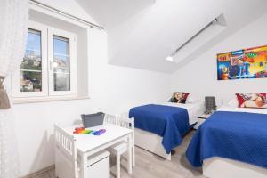 En eller flere senge i et værelse på "Villa Kostela"-Villa in nature with 4 bedrooms, 2 bathrooms and 2 kitchens + 37 billeder