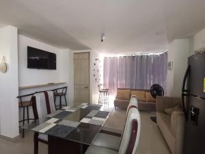 a living room with a table and a couch at Apartamento 301 - Edificio Salomon Diaz in Santa Marta