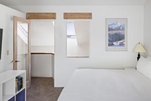 a bedroom with a bed and a window at Telluride Resort View at Double Diamond - ski-in-out and hot tub! in Telluride