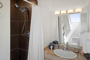 a bathroom with a sink and a shower at Telluride Resort View at Double Diamond - ski-in-out and hot tub! in Telluride +8 photos