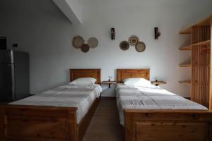 Postel nebo postele na pokoji v ubytování hakuna matata