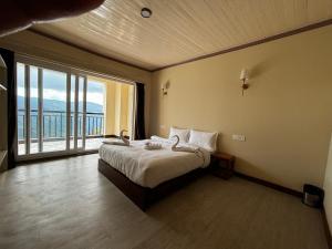 Postel nebo postele na pokoji v ubytování Asraya Homestay