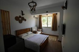 Postel nebo postele na pokoji v ubytování hakuna matata