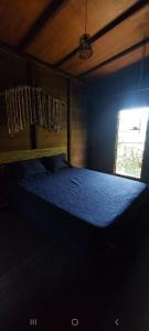 Postel nebo postele na pokoji v ubytování Morooka chalé AR com banheira em ALTER CHÃO + 10 fotografií