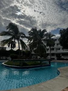 Bazén v ubytování Apartamento Tiziano Resort nebo v jeho okolí