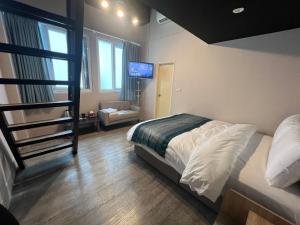 Postel nebo postele na pokoji v ubytování Mu-In Hotel