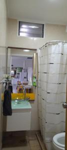 a bathroom with a sink and a toilet at Loft con pileta en Barrio San Carlos Mar del Plata in Mar del Plata