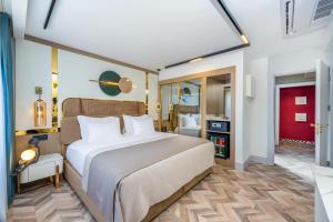 Postel nebo postele na pokoji v ubytování Lexia Hotels