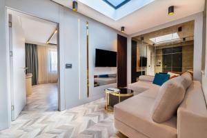 TV a/nebo společenská místnost v ubytování Lexia Hotels