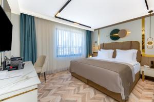 Postel nebo postele na pokoji v ubytování Lexia Hotels